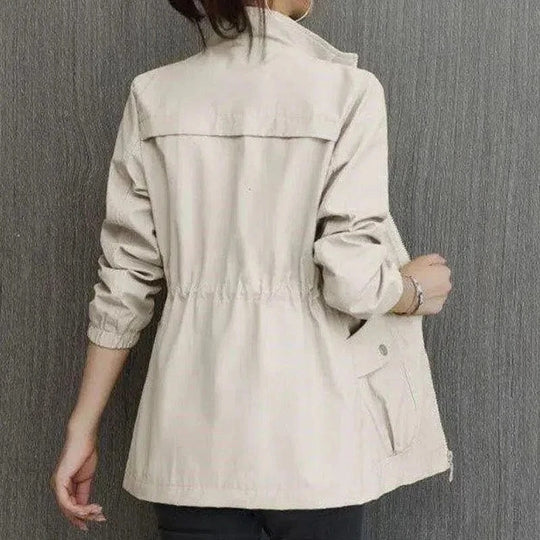 Women's lightweight waterproof trench coat by Jesie-London, khaki color, mid-length, adjustable waist, casual style, suitable for spring.