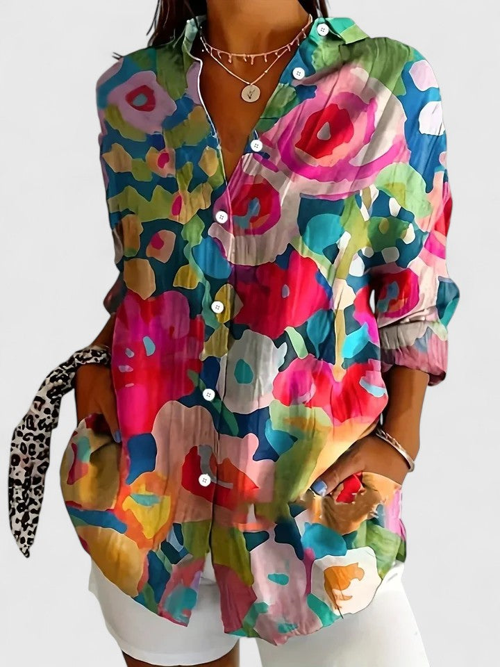 Women's colorful floral button-up shirt by Jesie-London, featuring vibrant flower patterns and a classic button-down style.