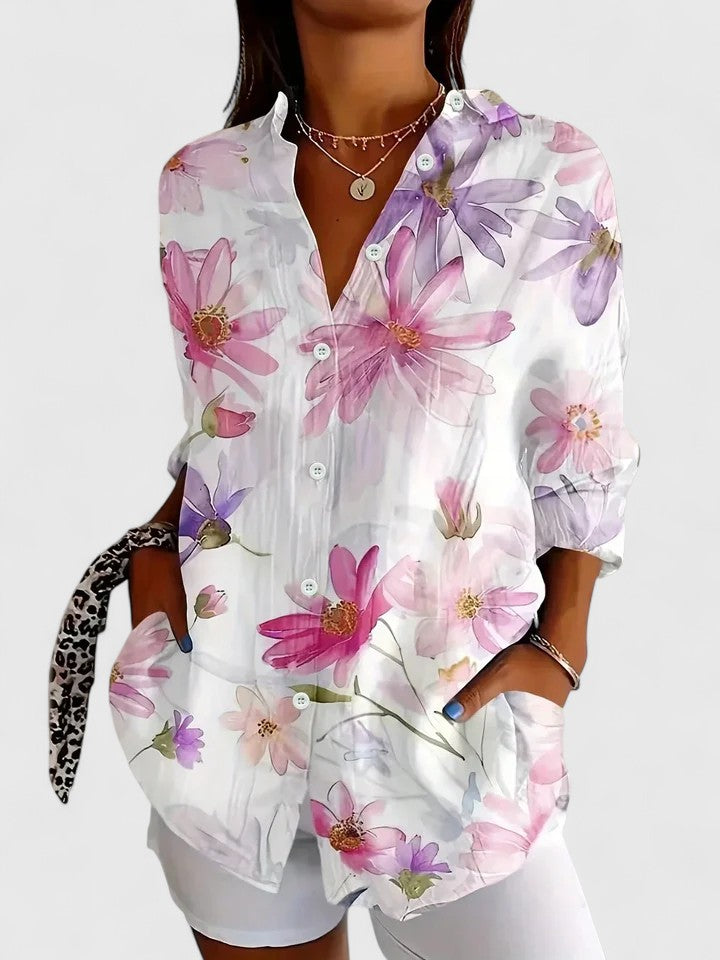 Women's Nancy colorful floral button shirt by Jesie-London, featuring vibrant floral patterns and classic button-down design.