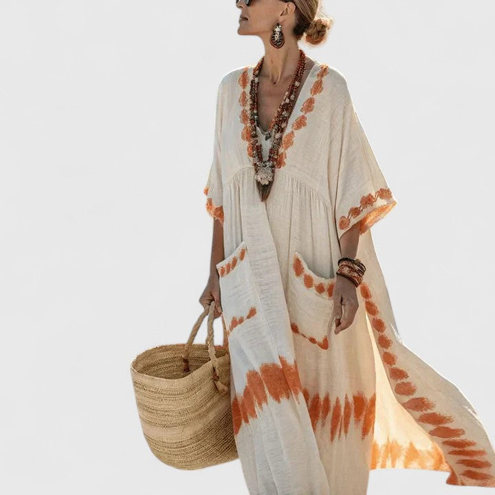 Elizabeth women's loose fit pocket maxi dress by Jesie-London, shown in a flowing fabric with side pockets and a relaxed silhouette.