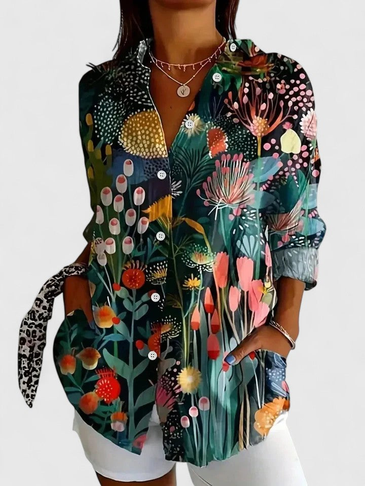 Women's colorful floral button-up shirt from Jesie-London featuring vibrant floral patterns and a classic collar.