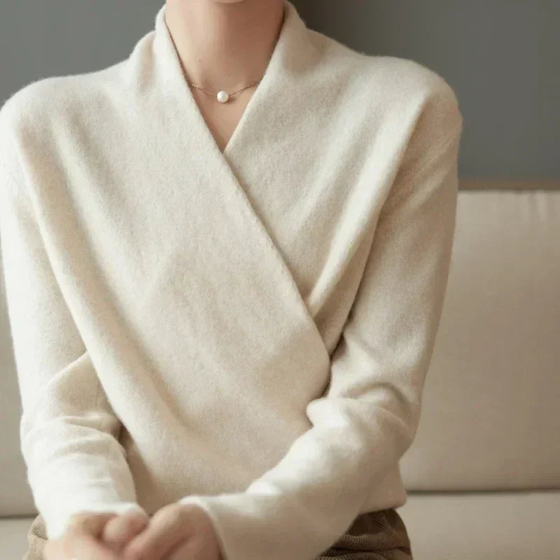 Women’s winter V-neck knit sweater by Jesie-London, featuring a cozy wrap design and classic V-neck, in soft knit fabric.