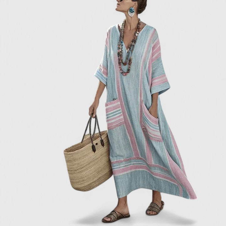 Elizabeth women's loose fit pocket maxi dress by Jesie-London, flowing fabric, featuring side pockets and a relaxed silhouette.