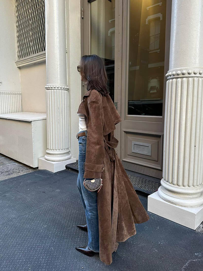 Women’s elegant trench coat with belted waist and lapel collar by Jesie-London, shown in a stylish front view.
