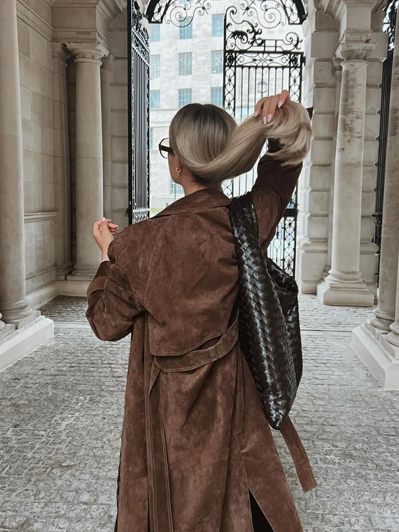 Women’s Jesie-London Mabel trench coat with belted waist, lapel collar, stylish design, shown on a model.