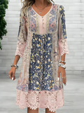 Women's boho printed V-neck midi dress by Jesie-London, featuring a relaxed fit and vibrant floral pattern.