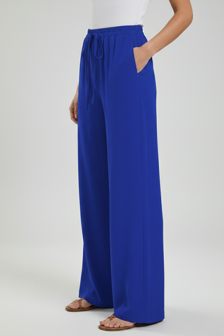 Catherine Jesie-London women’s palazzo trousers with drawstring waist and side pockets, relaxed fit, lightweight fabric.