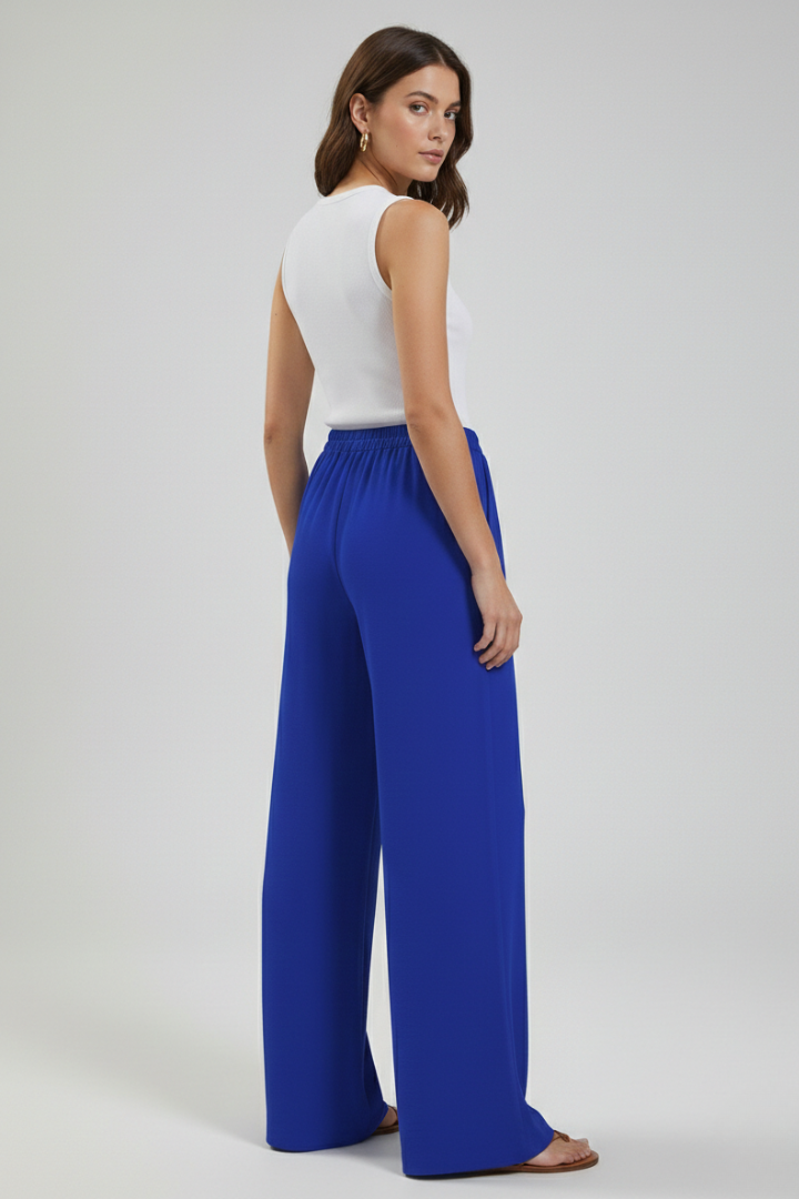 Catherine women's palazzo trousers by Jesie-London with drawstring waist and side pockets, shown in a relaxed fit style.