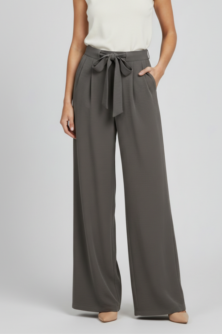 Women’s wide-leg palazzo trousers with drawstring waist and side pockets by Jesie-London, shown in a stylish relaxed fit.