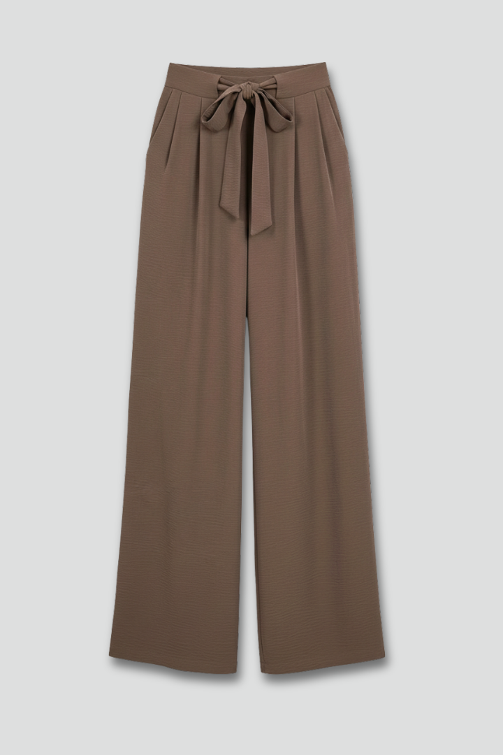 Women’s wide-leg drawstring waist palazzo trousers by Jesie-London with side pockets, stylish and comfortable for casual wear.