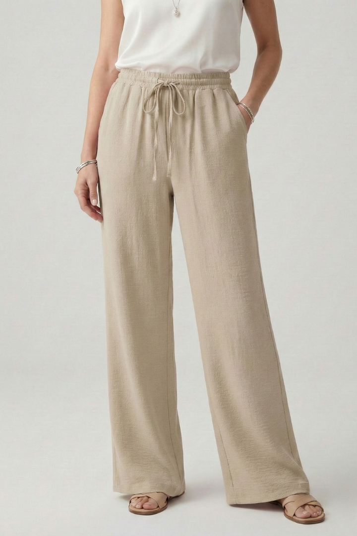 Bella women's casual palazzo trousers with drawstring waist and side pockets, stylish and comfortable for everyday wear.