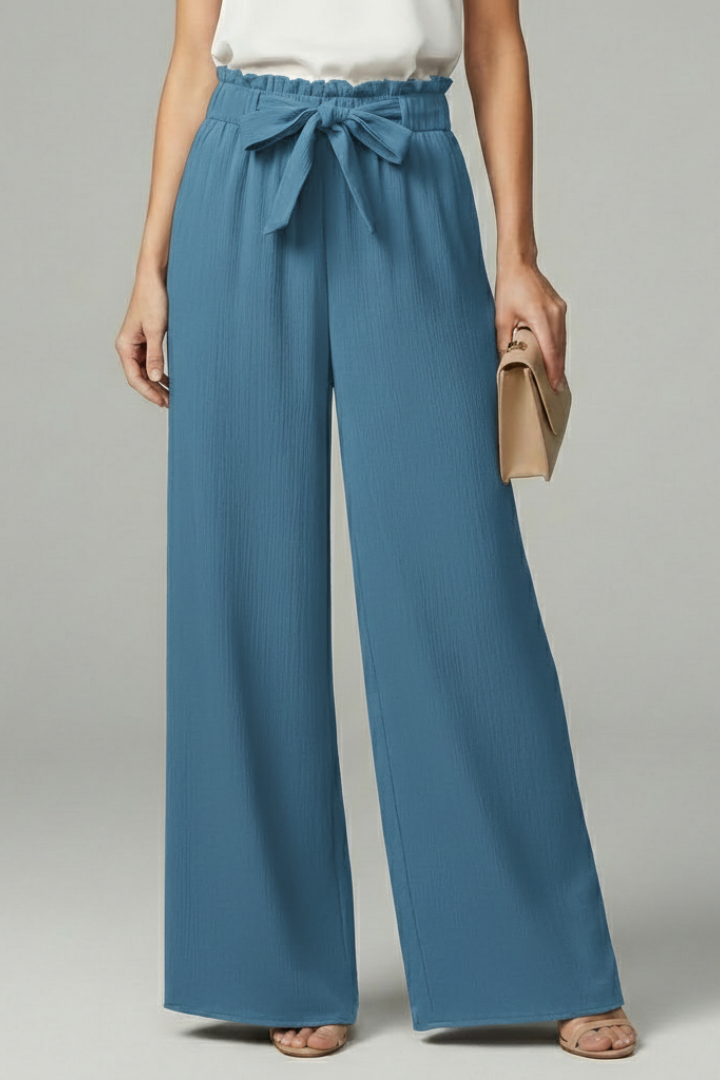 Jesie-London Charlotte women's palazzo trousers with tie belt and wide-leg design, shown in a stylish, flowy fabric.
