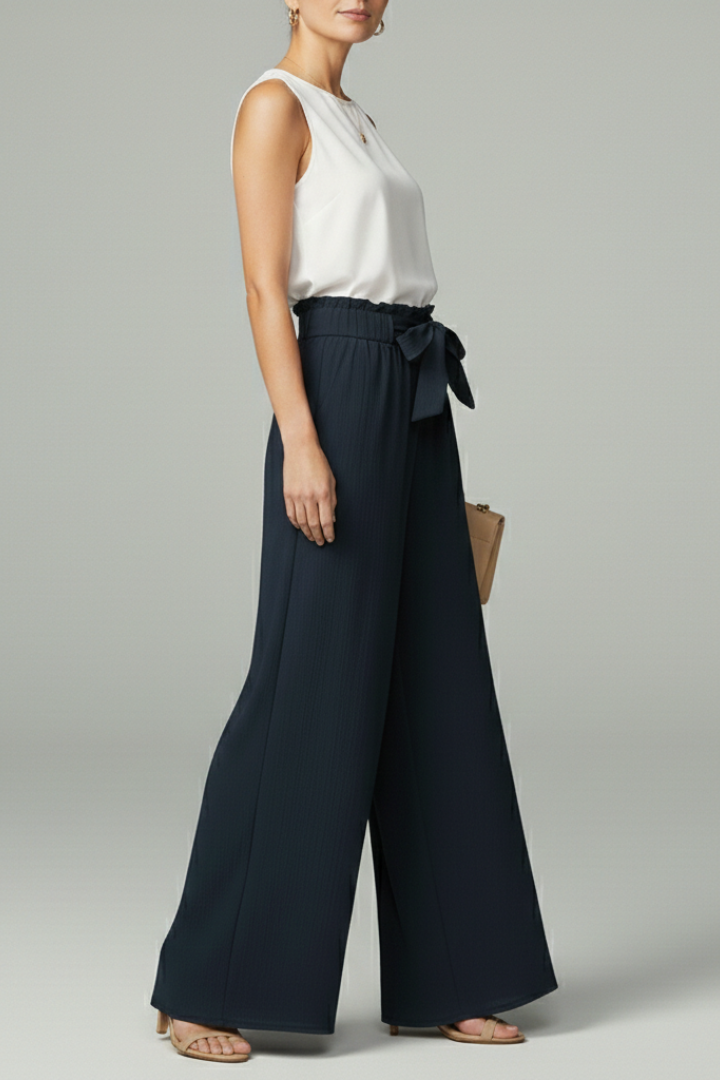 Women’s Charlotte palazzo trousers by Jesie-London featuring a tie belt and wide-leg design, shown in a stylish, relaxed fit.