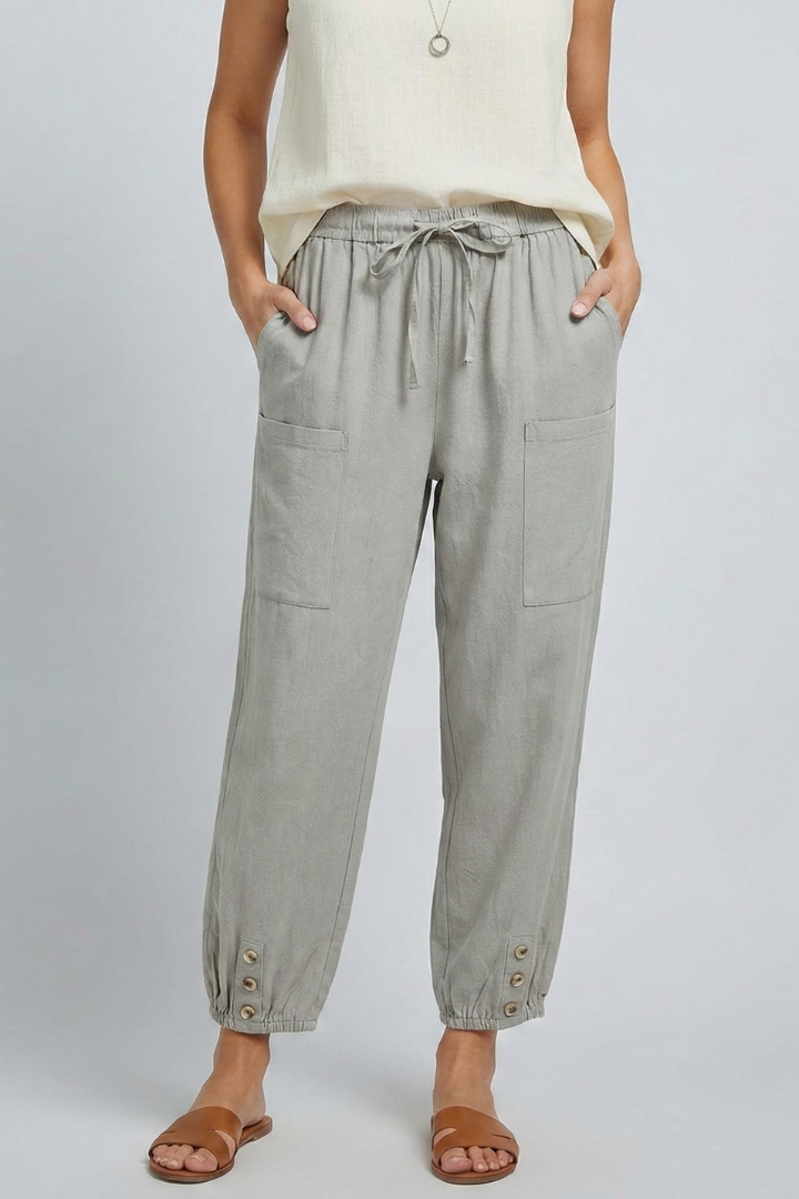 Women’s Jesie-London Amelia trousers with drawstring waist and button hem, shown in a casual, stylish fit.