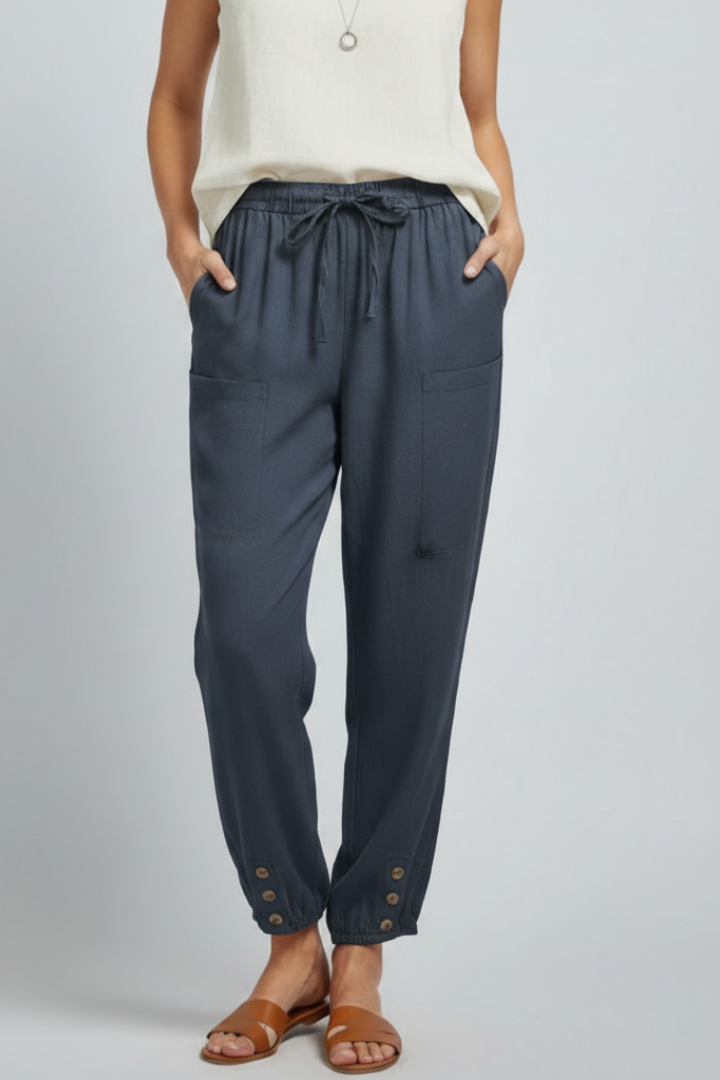 Jesie-London Amelia women's trousers with drawstring waist and button hem, shown in a stylish, casual fit on a model.