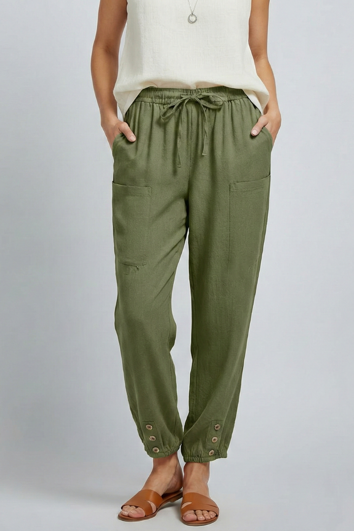Women’s Jesie-London Amelia trousers with drawstring waist and button hem, shown in a stylish fit and fabric detail.
