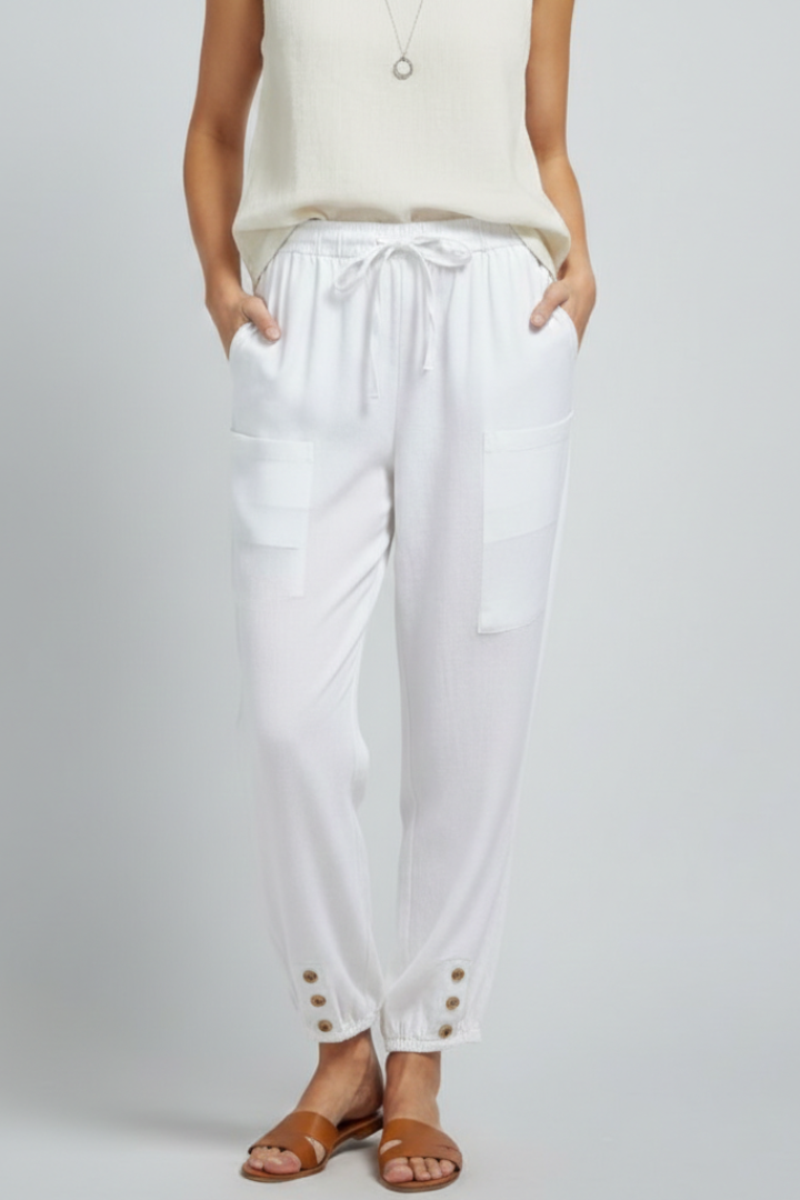 Jesie-London Amelia women's trousers with drawstring waist and button hem, shown in a relaxed fit on a model.