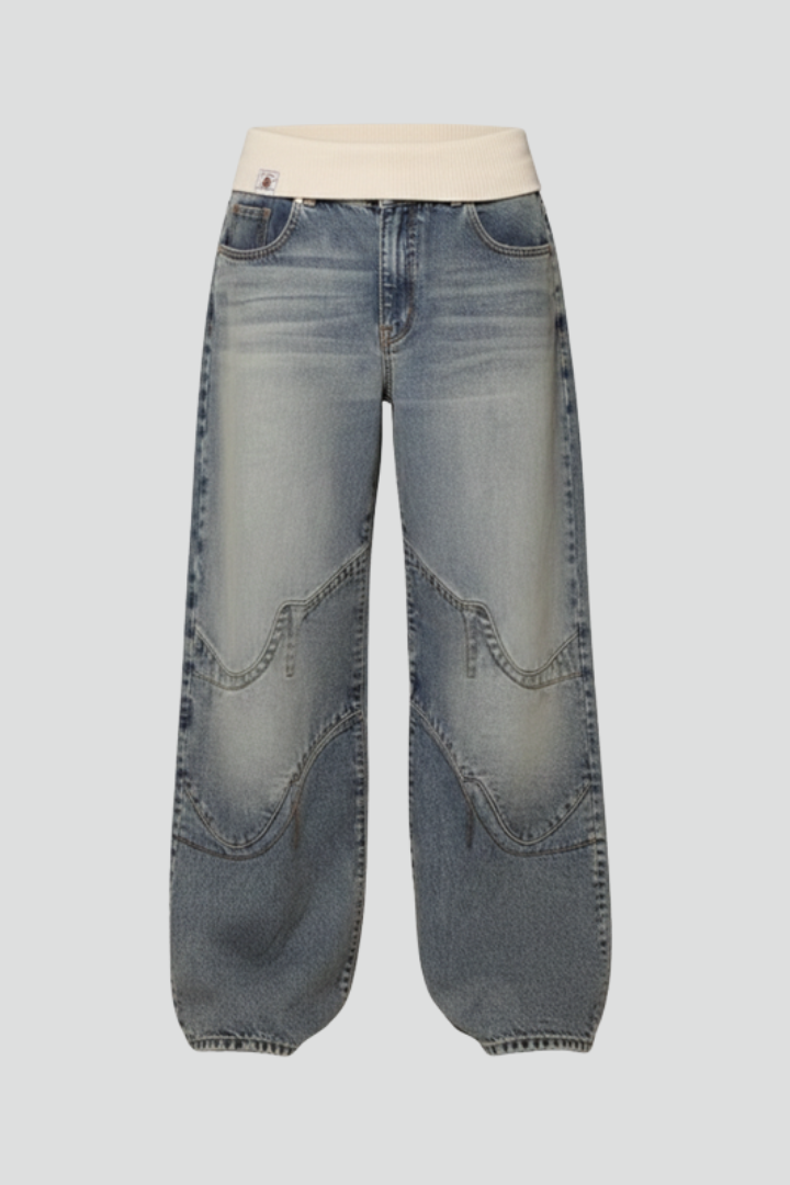 Women’s wide-leg denim trousers by Jesie-London with elastic waist and curved seam details, casual and comfortable fit.