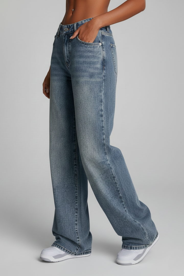 Women’s relaxed wide-leg denim jeans by Jesie-London featuring front closure and long hem, styled on a woman.