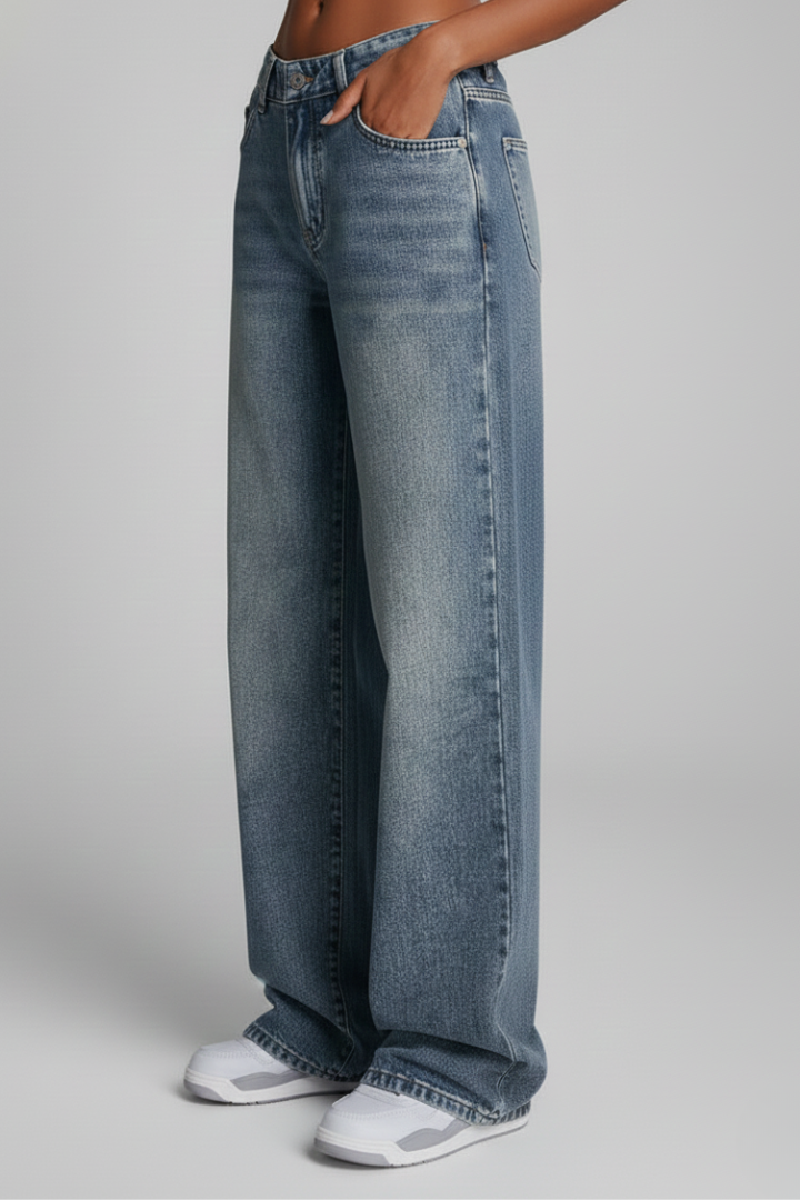 Women’s relaxed wide-leg denim jeans by Jesie-London with front closure and long hem, shown on a model.