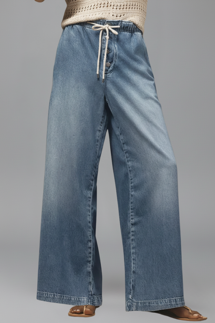 Women’s relaxed wide-leg denim jeans with drawstring waist and long hem by Jesie-London, shown on a model.