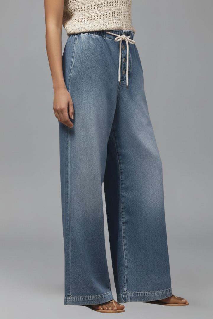 Women’s relaxed wide-leg denim jeans with drawstring waist and long hem by Jesie-London, shown on a model.