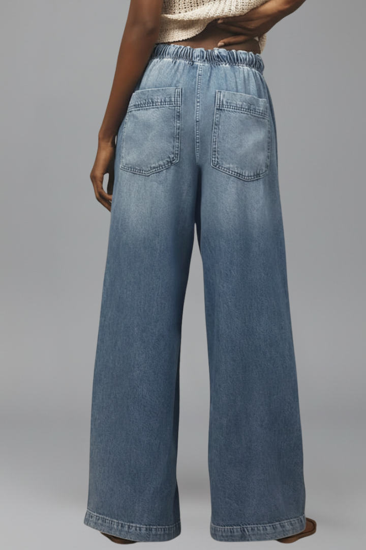 Women’s relaxed wide-leg denim jeans with drawstring waist and long hem, by Jesie-London, shown on a model.