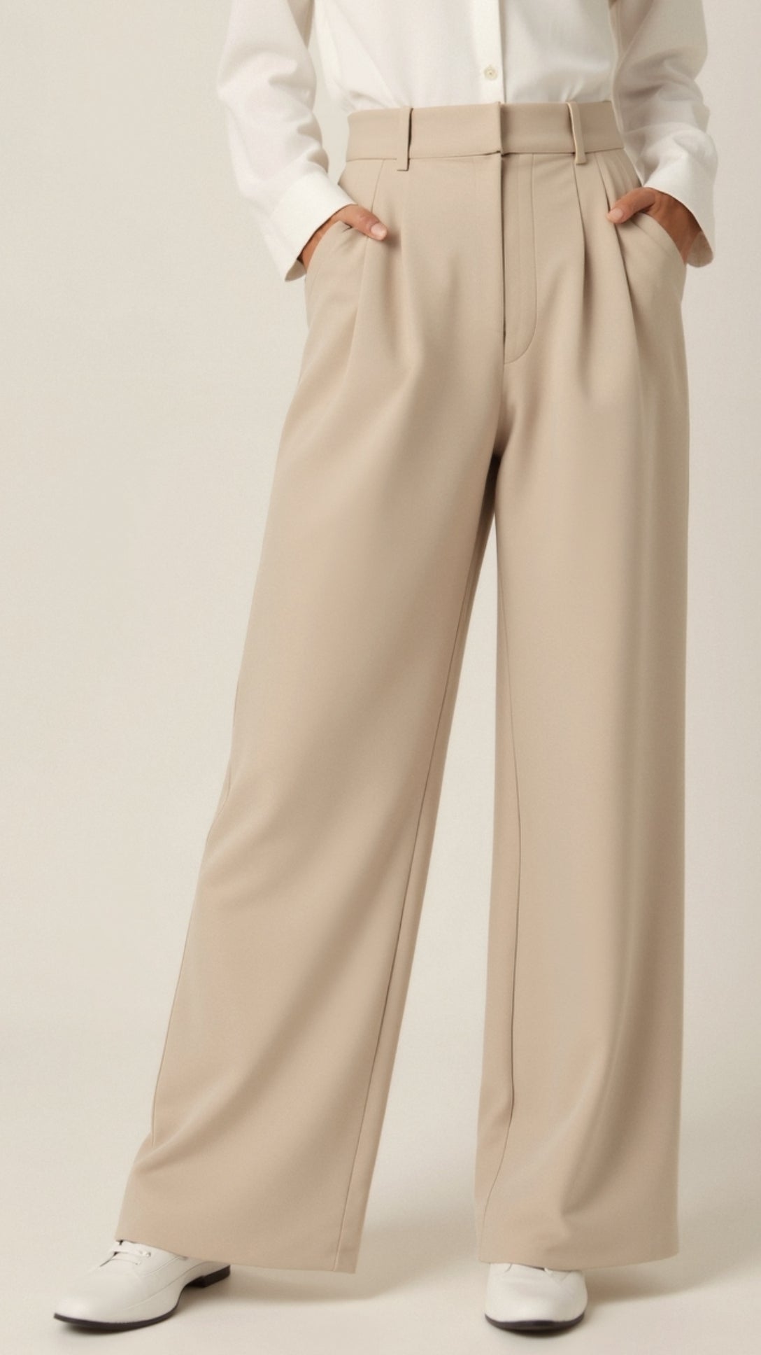 Women’s high-waisted wide-leg trousers by Jesie-London with pleated front, styled in a relaxed and elegant look.