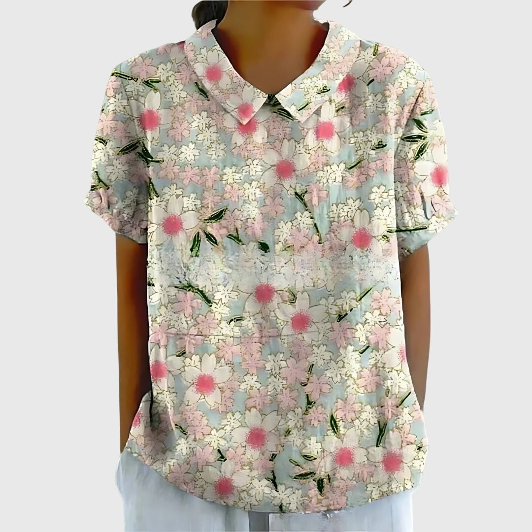 Women's floral collar short sleeve blouse by Jesie-London, featuring a stylish design and vibrant floral pattern.
