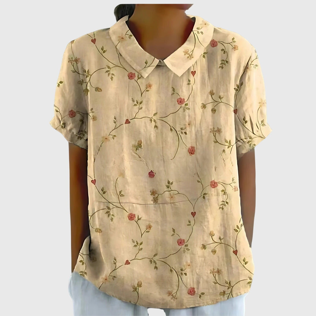 Jesie-London Eleanor women's floral collar short sleeve blouse with a stylish design and vibrant floral pattern.