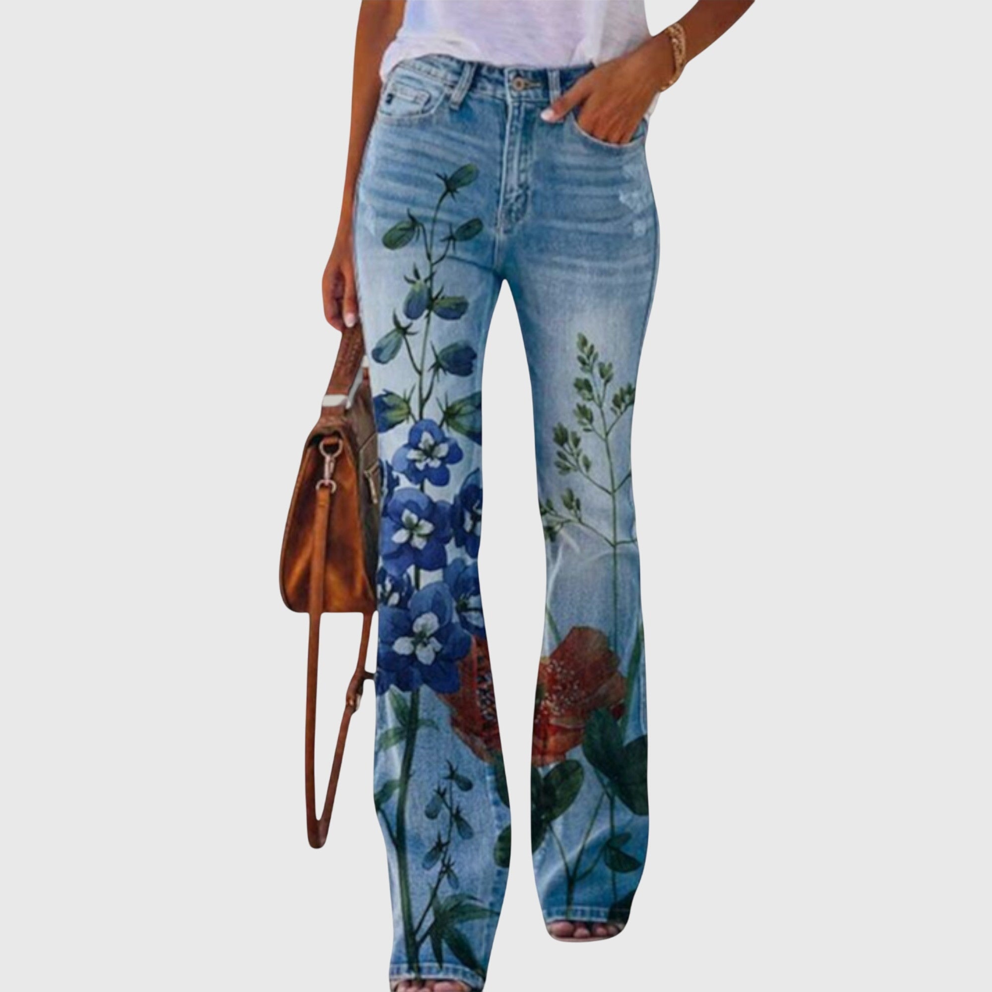 Women's floral printed skinny jeans from Jesie-London featuring a vibrant botanical pattern and fitted silhouette.