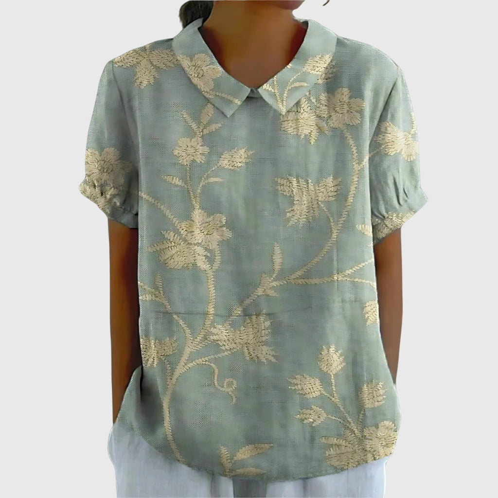 Jesie-London Eleanor women's floral collar short sleeve blouse with a stylish design and vibrant floral pattern.