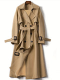 Jesie-London Hannah women's longline office trench coat, elegant and tailored, shown hanging with its classic style and neutral color.