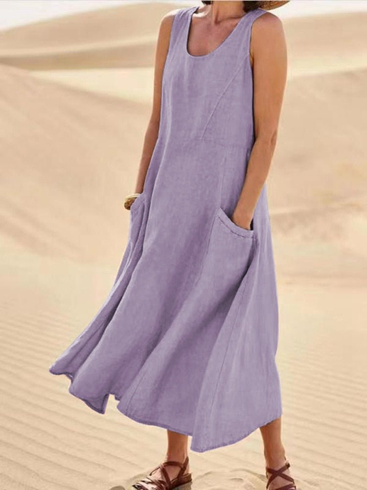 Light, airy linen maxi dress for women with sleeveless design and pockets by Jesie-London, shown in a casual style.
