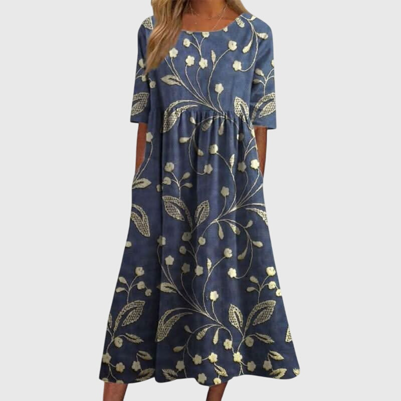 Jesie-London Ruby women's vintage floral midi dress featuring a fitted bodice and flowing skirt with vibrant floral print.