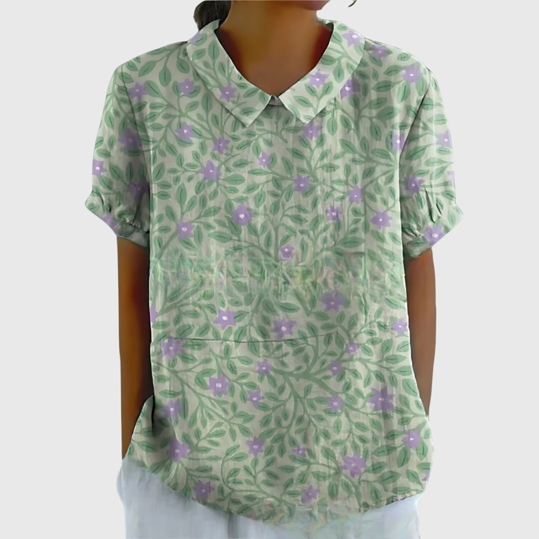 Jesie-London Eleanor women's floral collar short sleeve blouse with a stylish design and vibrant floral pattern.
