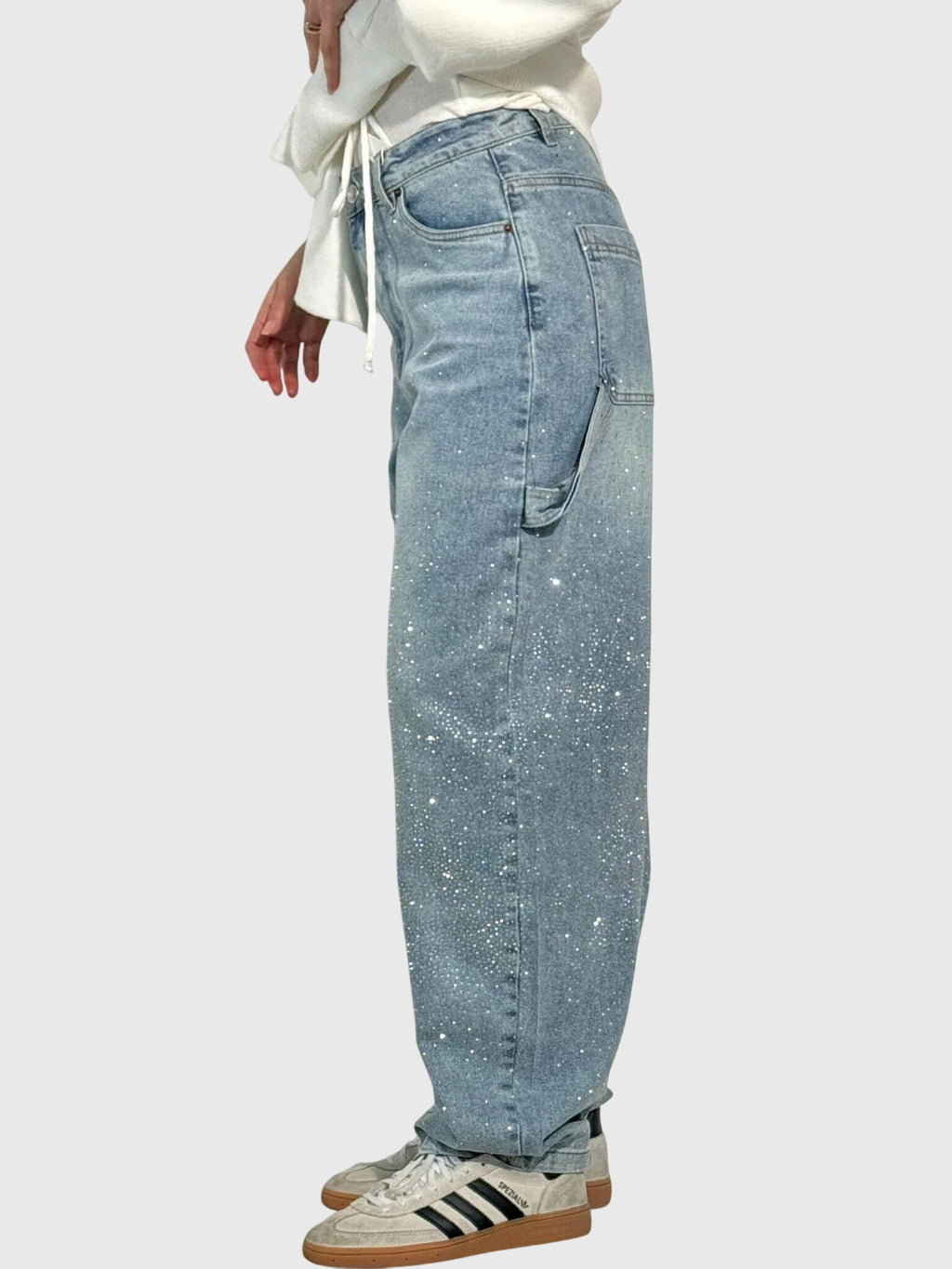 Women’s sparkle diamond denim pants by Jesie-London featuring shimmering embellishments and a classic denim fit.