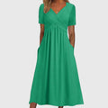 Megan women's V-neck flowy midi dress by Jesie-London, featuring a relaxed fit and elegant fabric in a soft, feminine style.