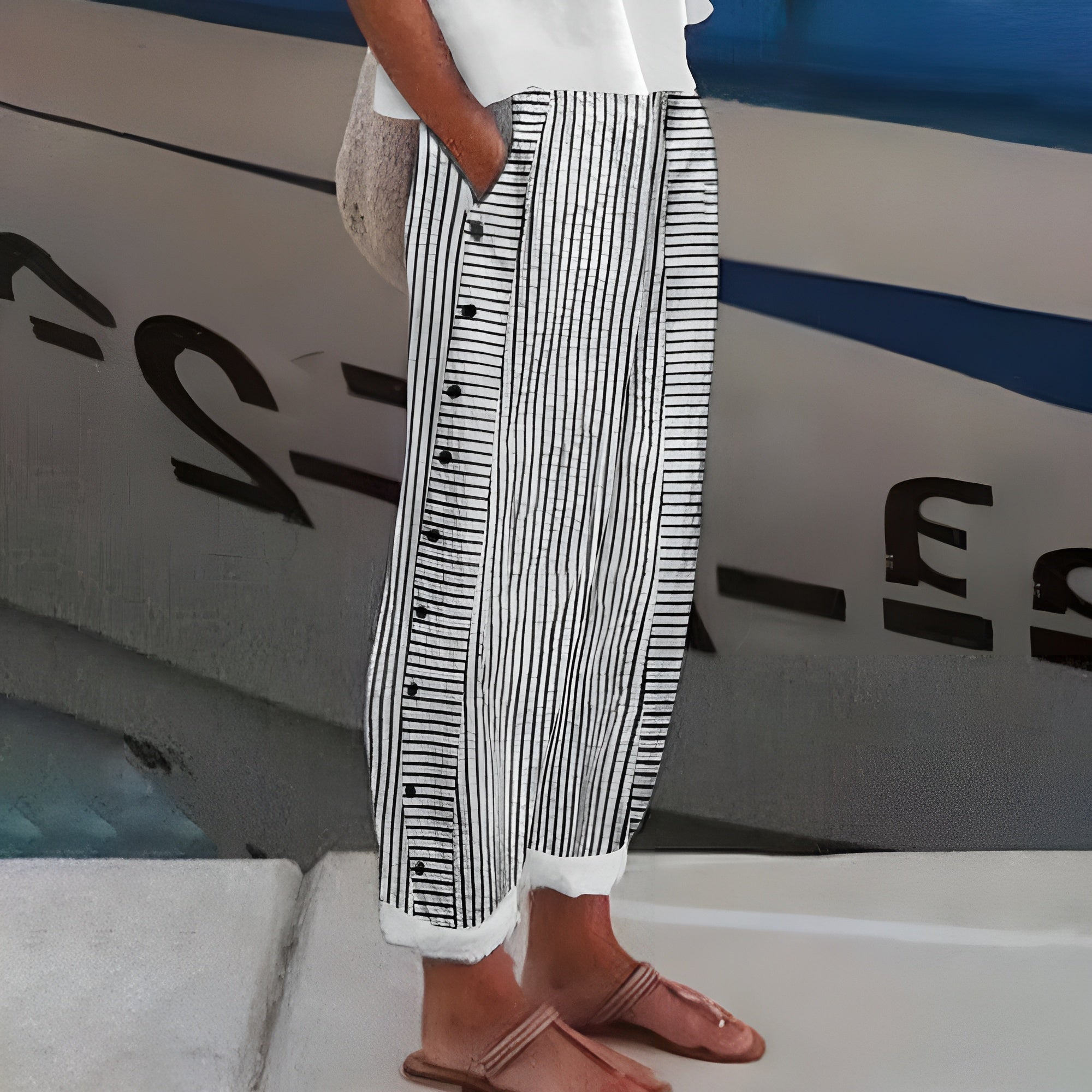 Jesie-London Amelia women's striped casual pants with button details, featuring a relaxed fit and stylish pattern.