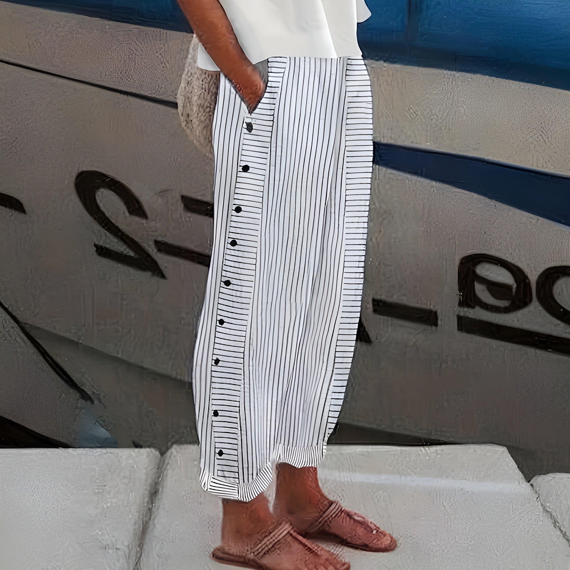 Women’s striped casual pants with button detail from Jesie-London, featuring a relaxed fit and stylish design.