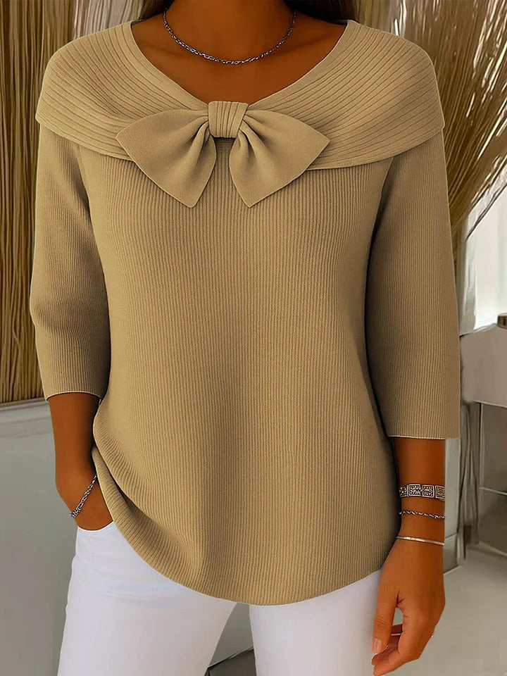 Jesie-London Anna women's three-quarter sleeve top with bow detail, shown in a close-up of the stylish sleeve and fabric texture.