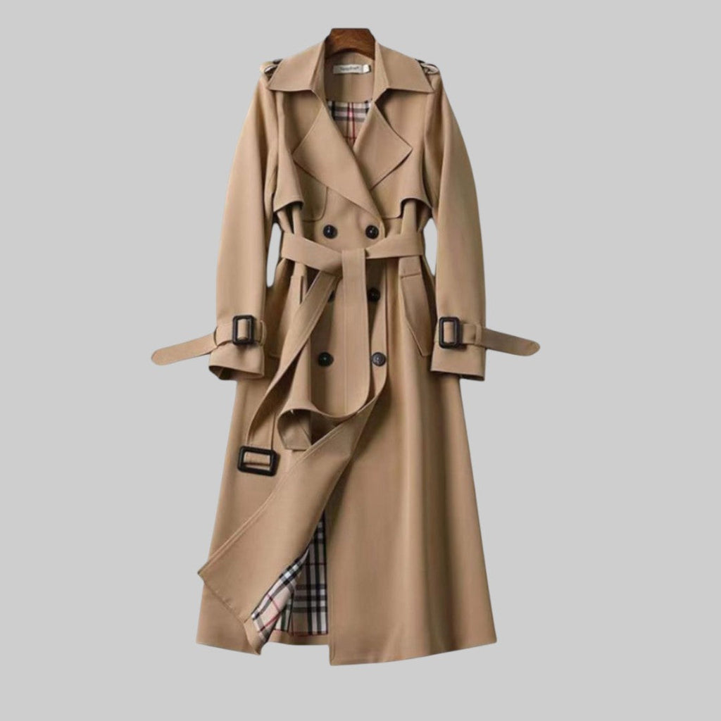 Women’s Jesie-London Emily belted double-breasted long trench coat with lapel collar and button details, shown on a model.