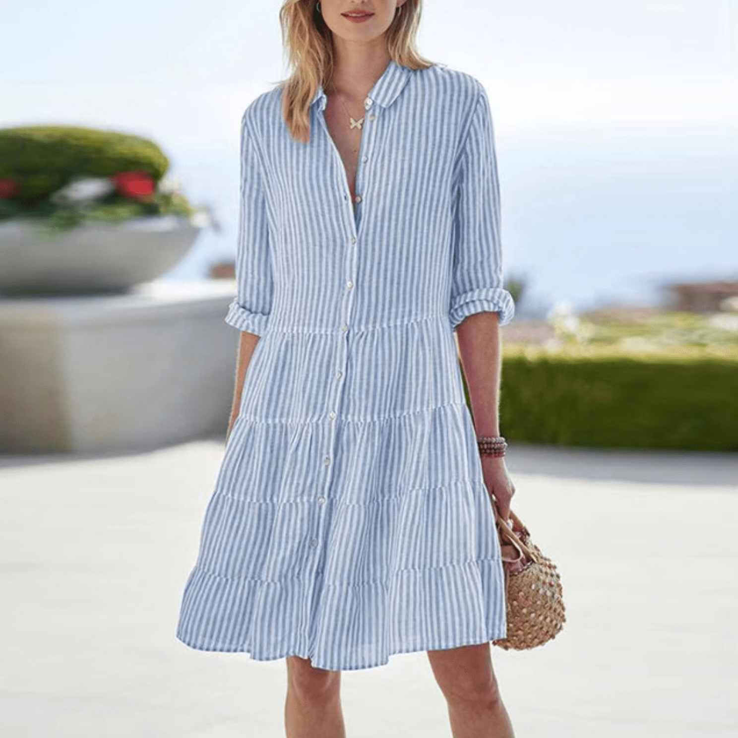 Jesie-London Grace women's striped button-front midi dress displayed on a hanger, featuring a classic pattern and elegant design.