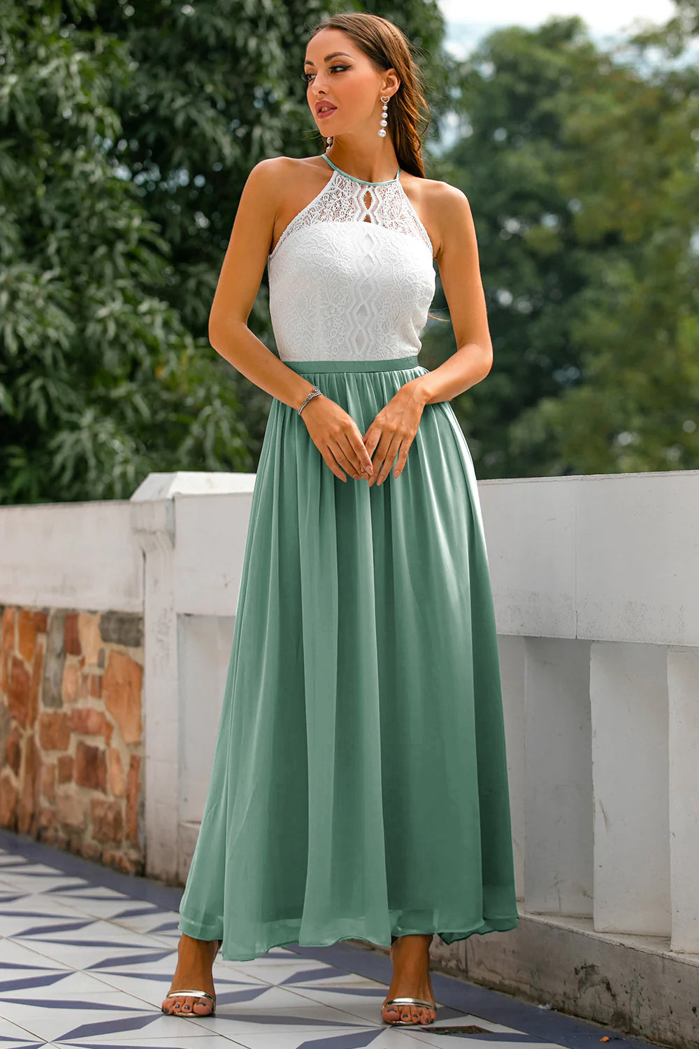 Jesie-London Camille women's halter maxi dress with open back, perfect for wedding guests in a stylish eucalyptus-colored gown.