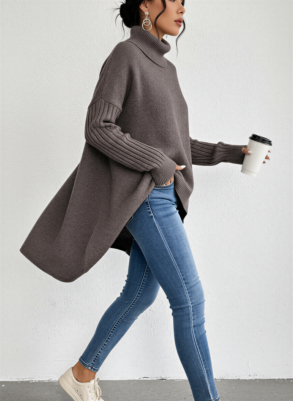 Jesie-London Alice women's oversized turtleneck sweater with front pocket, knit in soft, cozy fabric, in a neutral color.