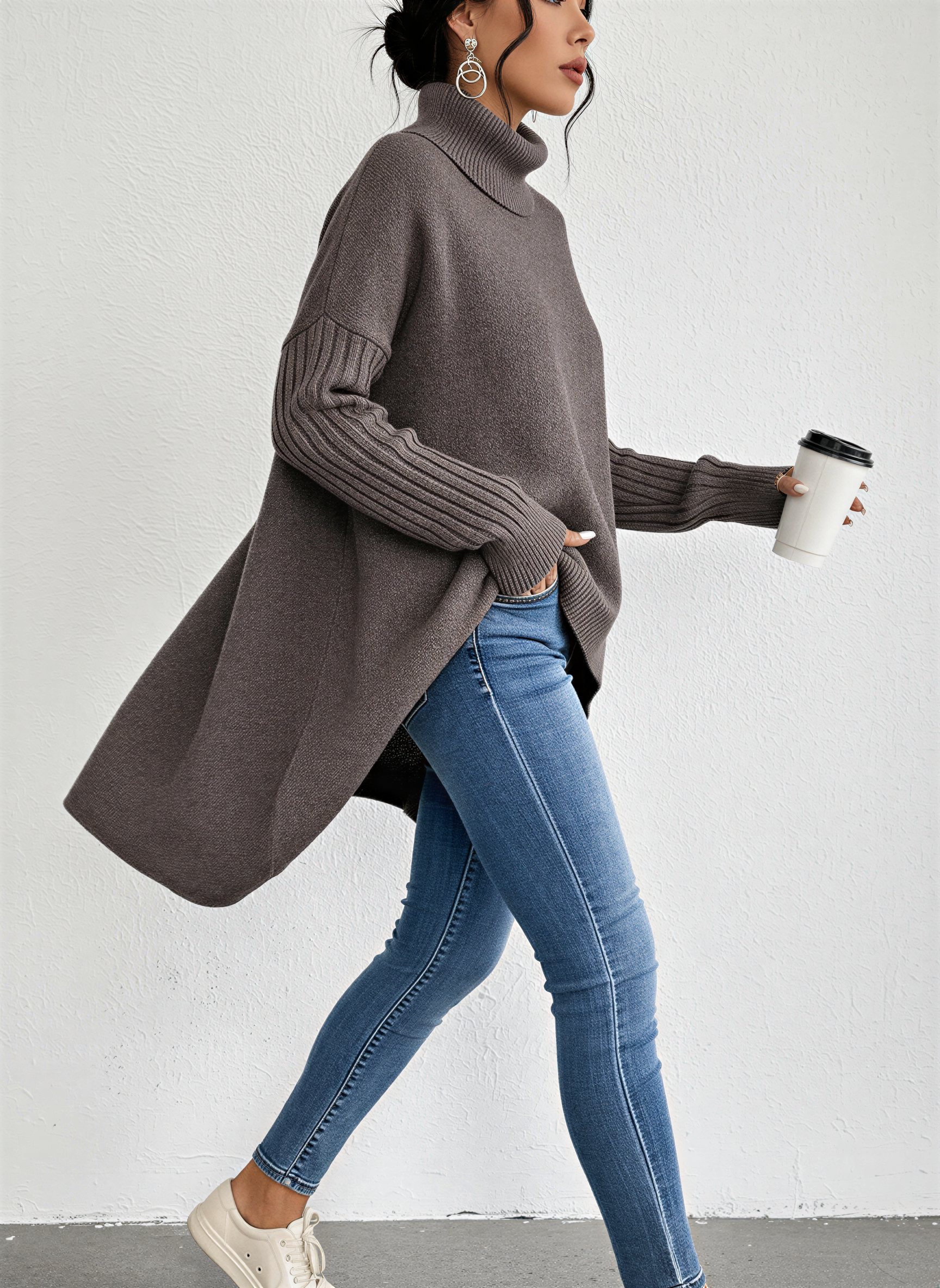 Jesie-London Alice women's oversized turtleneck sweater with front pocket, knit in soft, cozy fabric, in a neutral color.