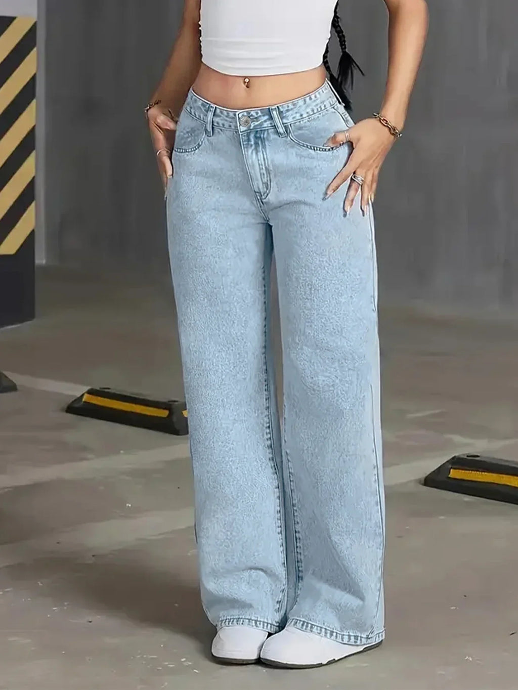 Light wash high-waisted wide-leg denim jeans for women by Jesie-London, shown on a model with a relaxed fit and classic style.