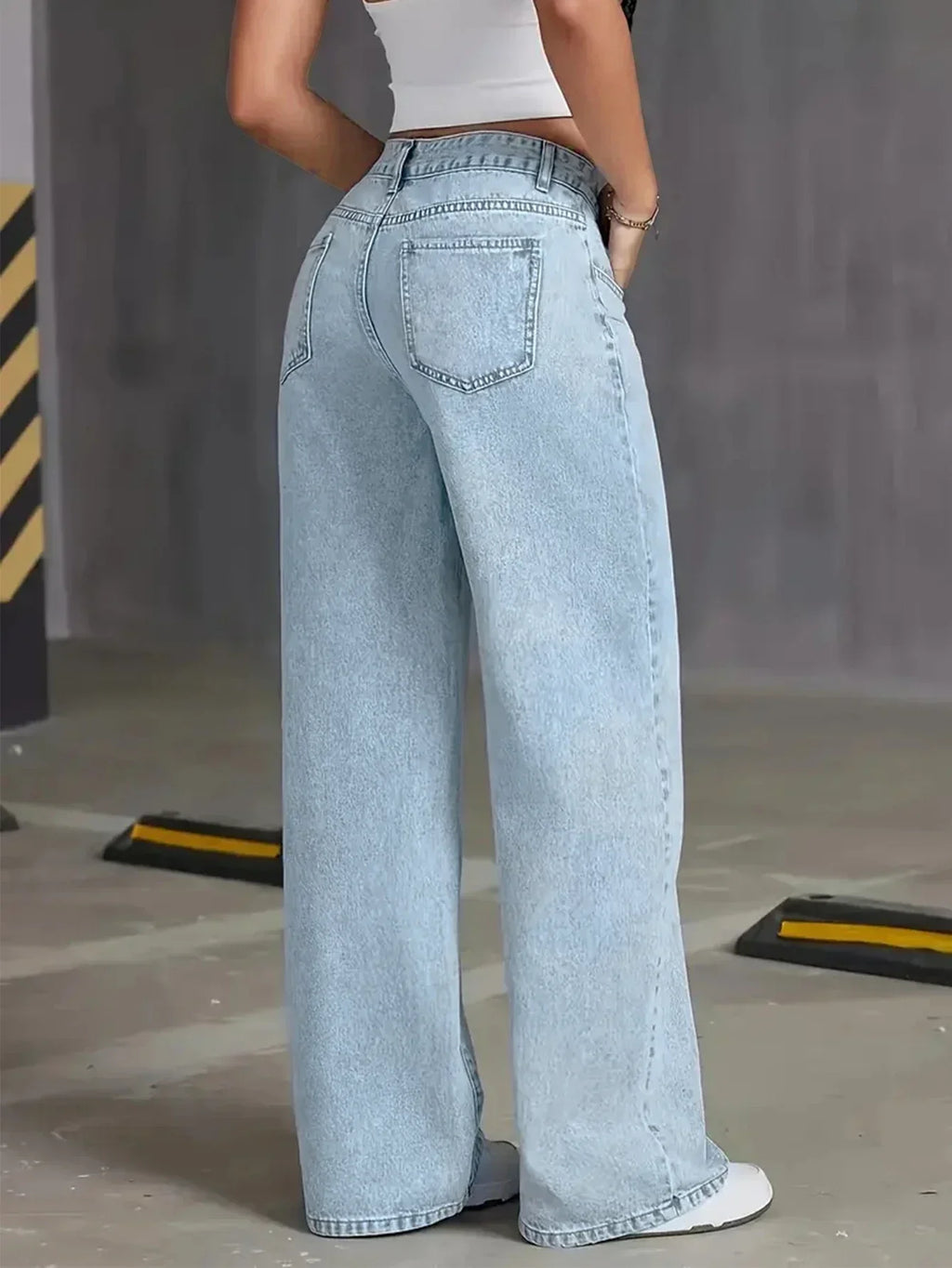 Women’s light wash wide leg denim jeans by Jesie-London, high-waisted style with a relaxed fit and classic five-pocket design.