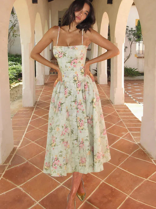 Women’s sleeveless floral strap midi wedding guest dress by Jesie-London, featuring a fitted corset style and elegant midi length.
