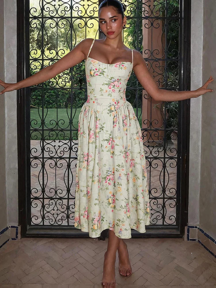 Women's sleeveless floral strap midi dress by Jesie-London, perfect for wedding guests, with a fitted corset style.
